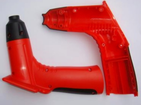 Molded housing halves showing the outer form and internal support features