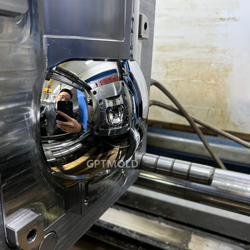 Polished mold insert mounted within a larger tool assembly